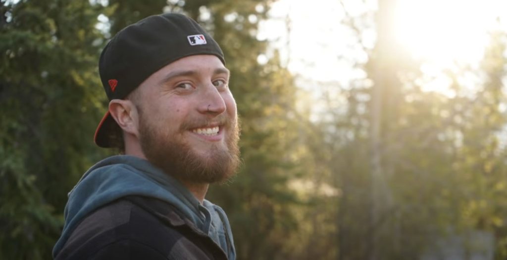 happy man in the woods after taking substance abuse program