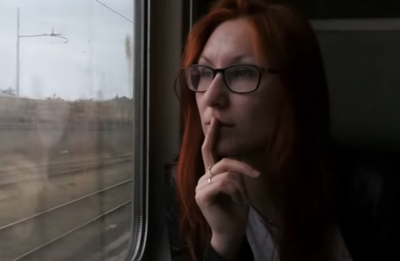 sad girl riding train