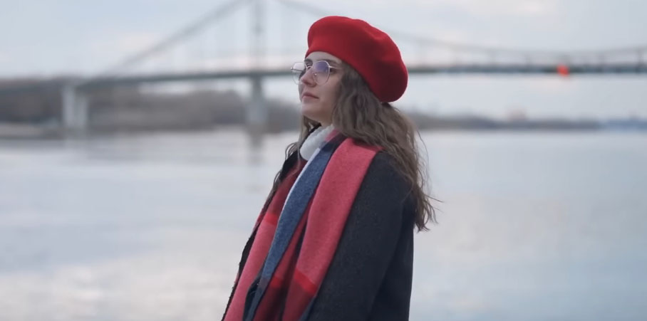 sad woman near a bridge standing