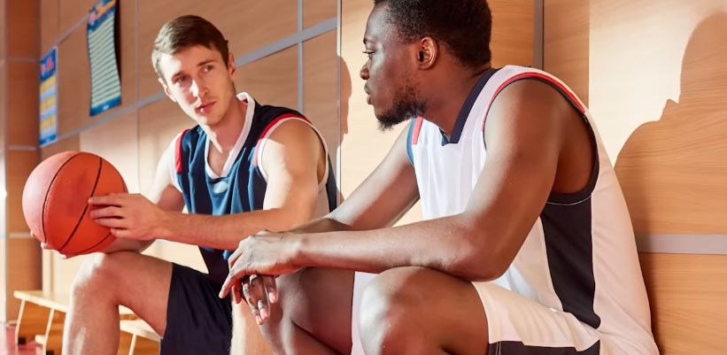 sad players sitting in the locker room